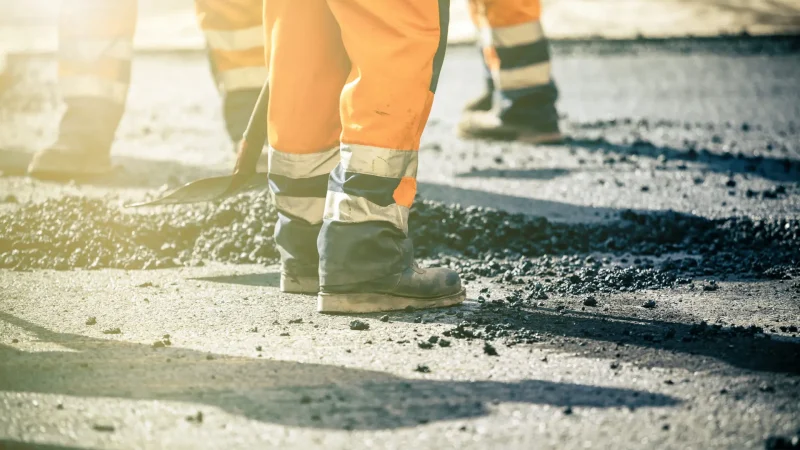 Teamwork, Group of workers on a road construction, team of people at work